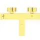 Zweigriffige Badarmatur in gebürstetem Gold, hergestellt von Ideal Standard. Sie zeigt zwei runde Griffe und eine klare, funktionale Form.